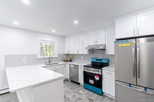 Tucked away at the end of a peaceful cul de sac and situated on just under an acre, this beautifully updated Colonial combines modern comforts with a serene, nature filled ...
