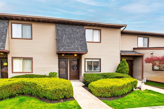 View of front of property with a shingled roof