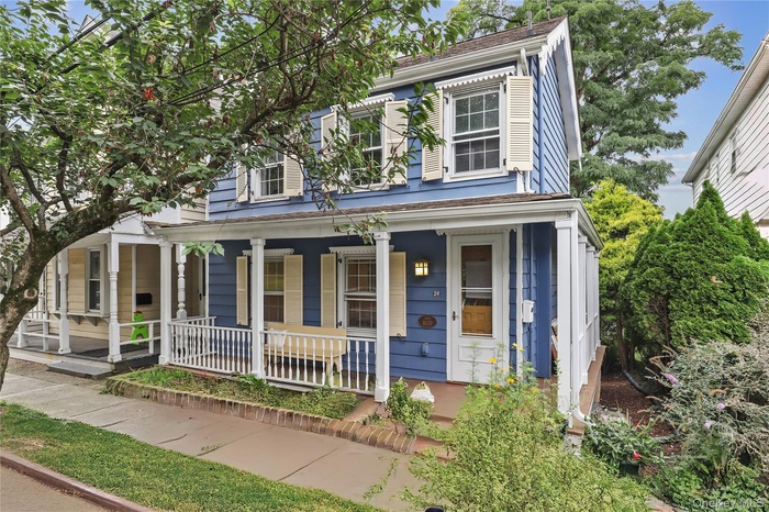 View of front of home featuring covered porch