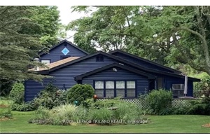 Beautiful year round home with lake views, across from the Port Franks marina, with large detached legal guest house in the back.