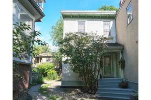 A condo alternative in the city, complete with parking and a private garden patio, just steps from Leslieville's popular shops and restaurants !