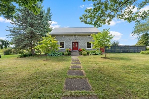 Outstanding 19th Century limestone situated on 32 picturesque acres on Wolfe Island, within a 15 minute ferry ride to downtown Kingston !