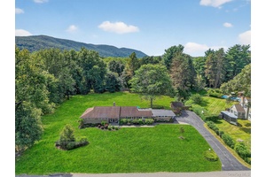 Set on one of the most coveted lots in the area, this well kept mid century ranch sits on 1.
