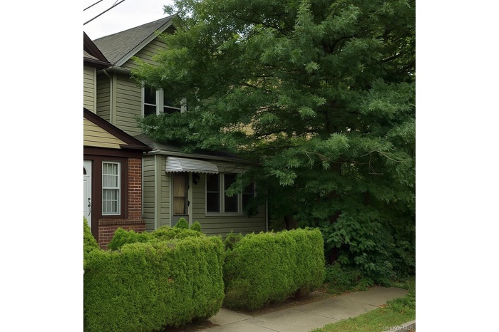 View of property exterior featuring brick siding
