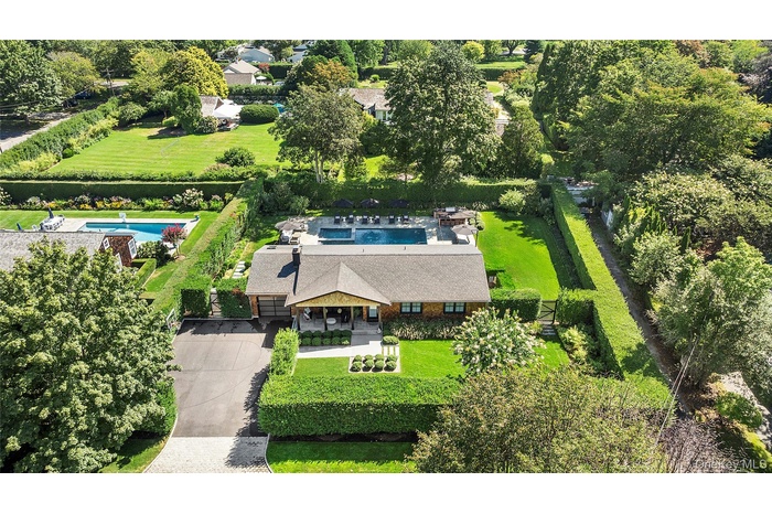 View from above of property featuring a pool area