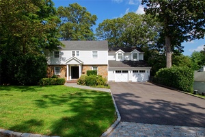 Welcome to 39 Squirrel Hill Road in East Hills a beautifully updated, move in ready 5 bedroom, 4 bath Colonial set on a pristine.