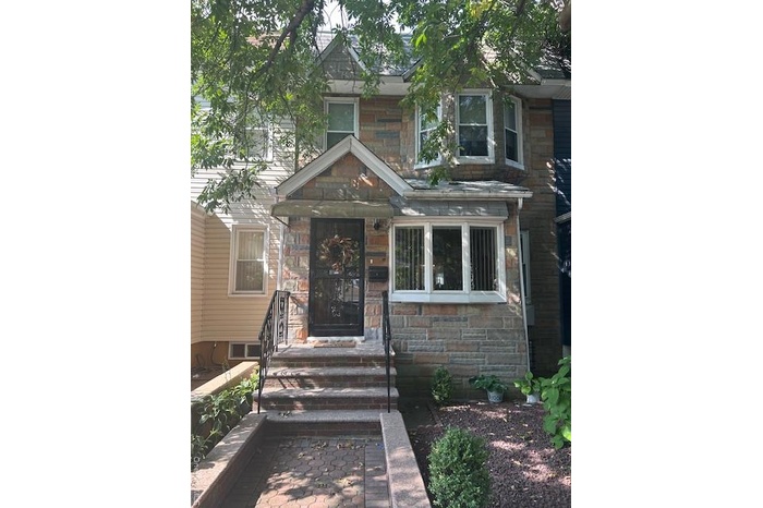 View of front of home featuring stone siding