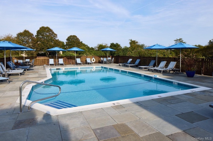 Community pool with a patio area