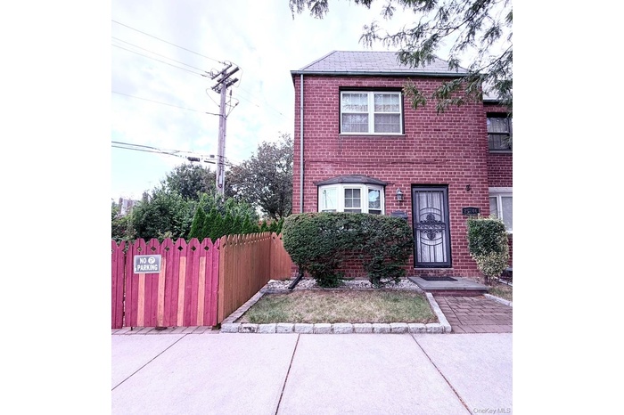 View of front of property with brick siding