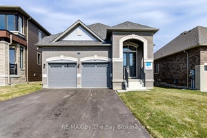 All brick, newly built 1, 649 sq ft bungalow by Zancor Homes.