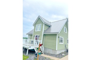 Superb quality, well designed custom home, with majestic, long views down Wilson Lake, and a dreamy 30 x 42 garage workshop art studio.