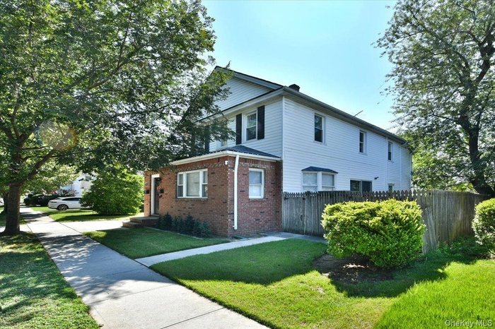 View of side of home featuring brick siding