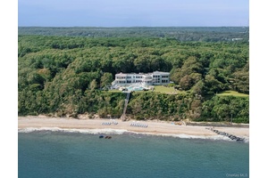 Tucked away on over 8 acres of elevated land in the exclusive Belle Terre enclave, this sprawling waterfront estate offers rare privacy and sweeping vistas of the Long Island Sound.