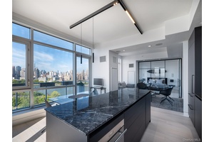 Rising high above the East River, Residence 18B at East River Tower is a rare offering one of only two homes on the 18th floor.