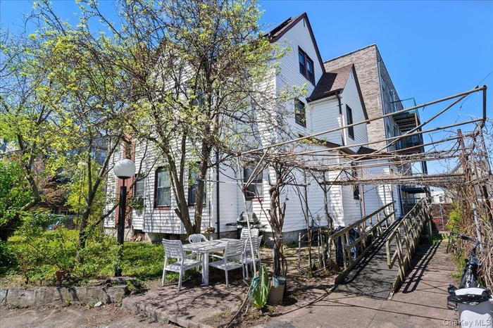 View of property exterior featuring outdoor dining area