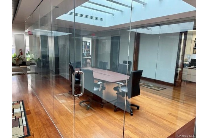 Office with wood finished floors