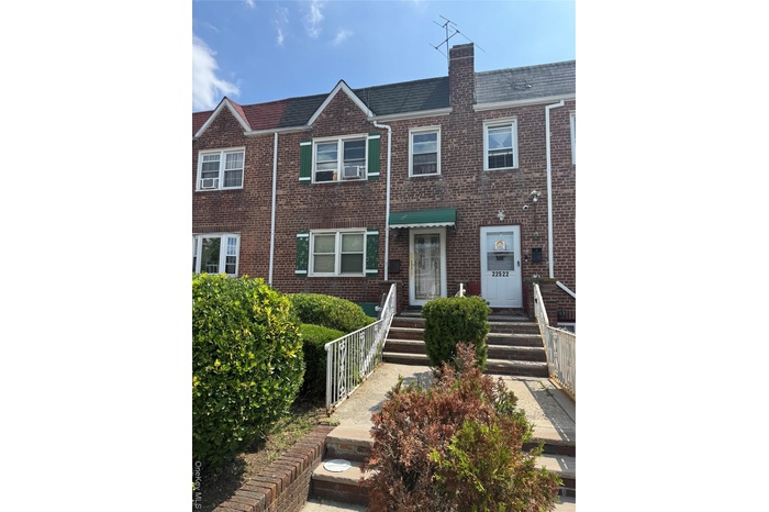 Traditional-style house featuring brick siding and a chimney