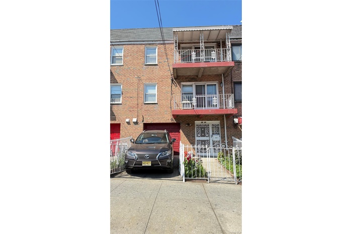 View of property with driveway