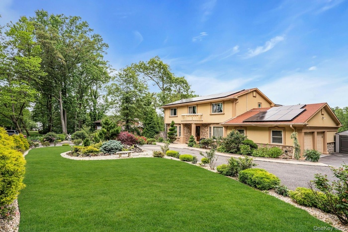 Professionally landscaped and designed. Solar panels owned.