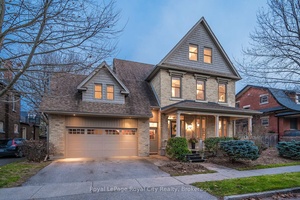 Discover timeless charm in this exquisite century home, perfectly situated on a tranquil street just steps from downtown.