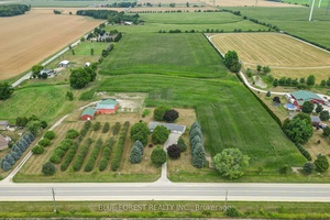 Set on 21. 5 acres, this property offers a rare combination of comfortable family living, productive land, and versatile outbuildings.