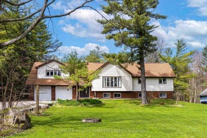 Welcome to this beautiful detached home set on approximately 1.