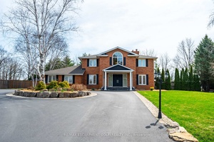 Situated on a quiet, beautifully manicured 0.