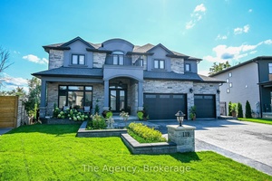 Nestled on a ravine pie shaped lot with no rear neighbors, this custom built estate home inWelland offers over 5, 000 SF of luxurious living space.