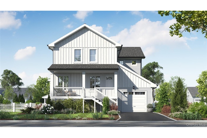 Modern inspired farmhouse featuring covered porch and a garage