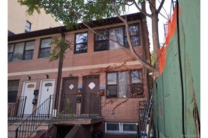 This Duplex Style Home Features 5 Bedrooms, 2 Full Baths and driveway parking.
