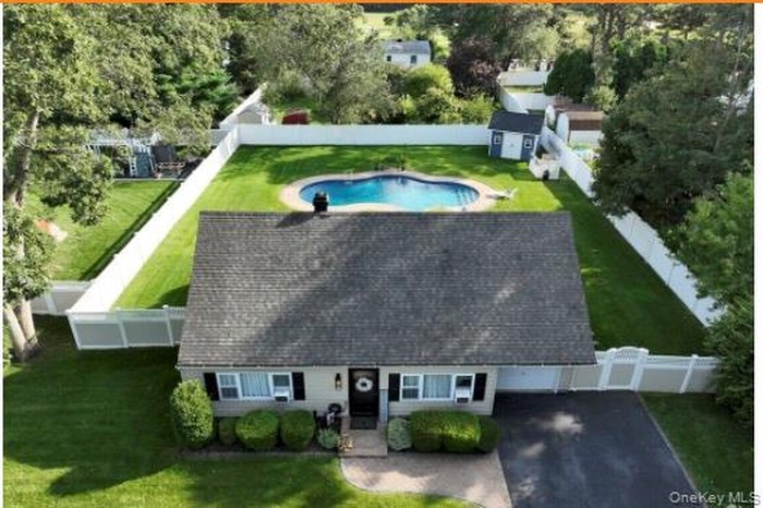 View from above of property featuring a pool area