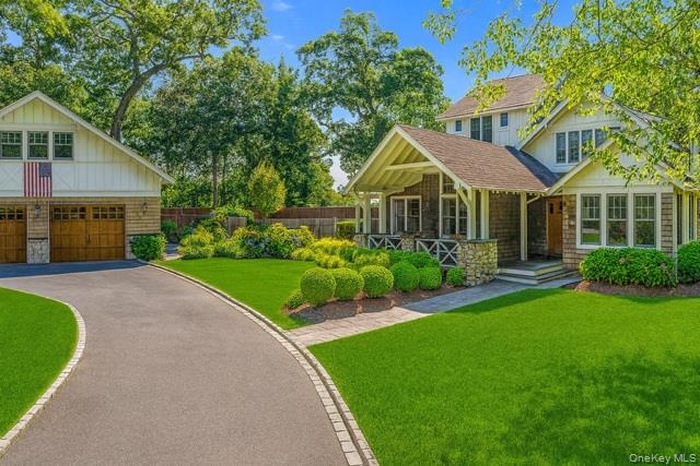 Craftsman house featuring a porch and roof with shingles