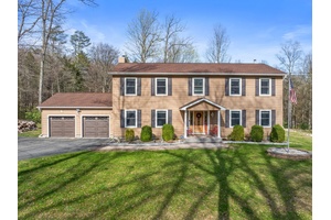 Welcome to this stunning colonial, gracefully nestled on nearly seven serene acres within the sought after Pine Bush School District.