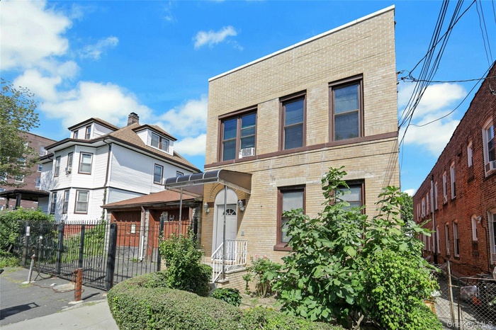 View of front of property featuring brick siding