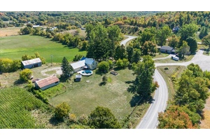 Step back in time with this classic two story farmhouse, built in 1834, set on a private 1.