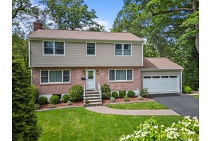 Conveniently situated on a quiet, tree lined street in highly sought after Gedney Meadows, this beautifully updated center hall Colonial offers over 2, 500 square feet of lovely living space.