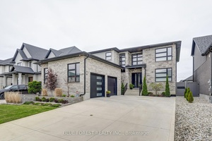 This masterpiece offers over 5000 sq ft of finished space, towering 10' ceilings on the main floor, a Control4 smart home system, a gourmet kitchen with butler's pantry, hardwood floors, ...