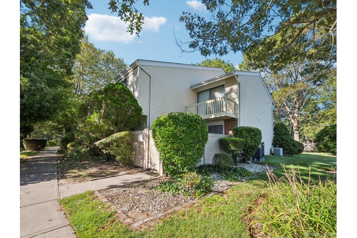 Large corner unit with private fenced patio with newly redone balcony.