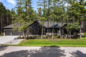 Welcome to 107 Louise Creek Crescent, a stunning 5 bedroom plus den, 5 bathroom bungalow perfectly situated on a quiet, tree lined street in Elmwood.