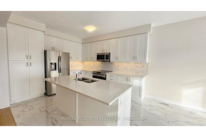 Two Years New, charming layout detached house with a double garage and double door entrance, nestled on a premium ravine lot.