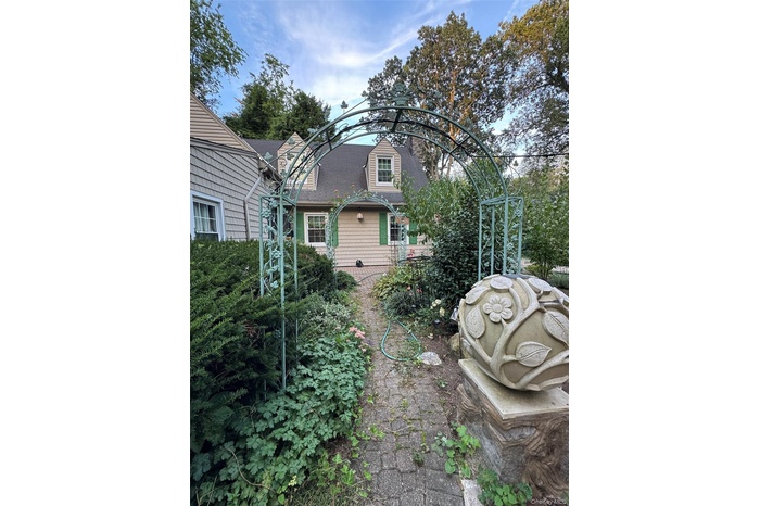 Back of property with roof with shingles