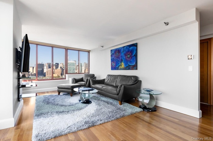 Living room featuring light wood finished floors and baseboards