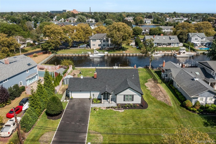 Aerial view of residential area with a nearby body of water