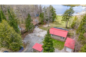 Enjoy the beauty of lakeside living year round at this well kept two bedroom bungalow on quiet and scenic Robbs Lake.
