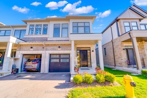 This stunning two story brick end unit townhome is located in one of Oshawa's most sought after modern communities.