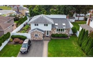 This beautifully maintained single family split level home offers 4 spacious bedrooms and 2 full bathrooms in the desirable Hicksville School District.