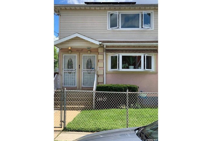 View of front of house with a gate