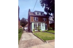 A rare opportunity for a legal mother daughter brick home totaling 5 bedrooms with separate entrance to each of the three levels and the basement, and a full bathroom on ...