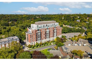 Elegant 1 bedroom, 1 bathroom suite at the prestigious Riverhouse Condominium at the Old Mill, featuring floor to ceiling windows that invite an abundance of natural light.