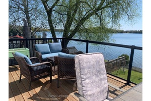 Morning Coffee on the water front deck watching the sunrise The peaceful tranquility of Chelsey Lake in the morning will set the mood for the day.